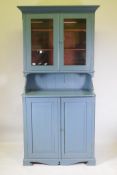 A Scandinavian painted wood dresser with glazed upper section over two cupboard door base, 215 x 100