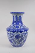 A blue and white porcelain vase with scrolling lotus flower decoration, Chinese Qianlong seal mark