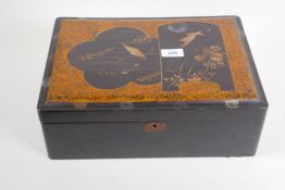 A Meiji lacquer box with gilt decoration of carp and a birds in a moonlit sky, 36 x 26 x 13 cm