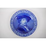 A blue and white Delft charger depicting Rembrandt, marks to the base, AF repairs, 41cm diameter