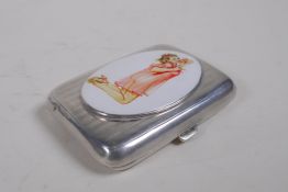 A hallmarked silver cigarette case with a later applied cold enamel plaque depicting a pin-up