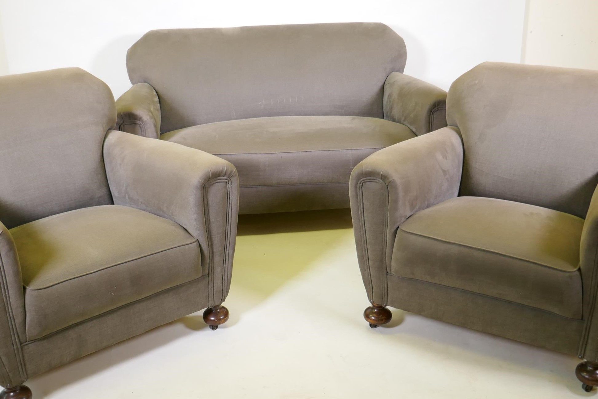 An Art Deco three piece suite, settee and two armchairs, well upholstered in a neutral fabric, 145cm - Image 2 of 6