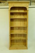 A pine open bookcase with five adjustable shelves, 90 x 25 x 200cms