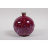 A Chinese flambe glazed porcelain pomegranate shaped bud vase, 12cm high