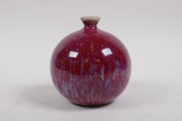 A Chinese flambe glazed porcelain pomegranate shaped bud vase, 12cm high