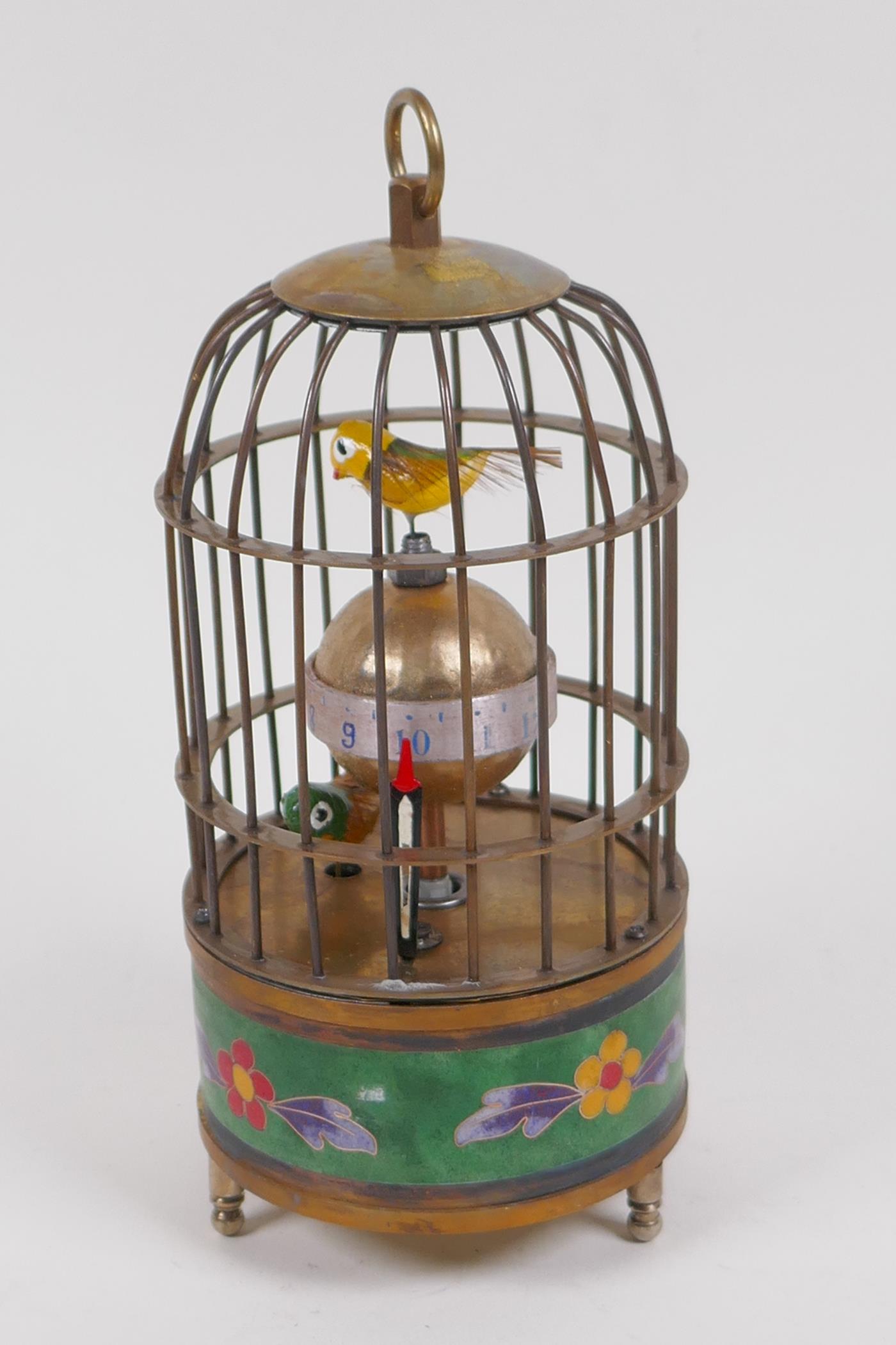 A cloisonne and brass birdcage mantel clock, 17cm high, winder absent