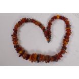 A graduated natural amber bead necklace, 45cm long