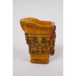 A Chinese carved bone libation cup with kylin decoration, 7cm high