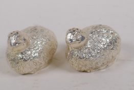 A pair of silver plated salts cast in the form of quail, 7cm long
