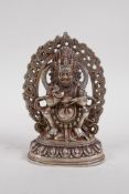 A Tibetan white metal figure of a wrathful deity, 16cm high
