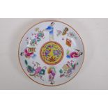 A famille rose enamelled porcelain cabinet dish decorated with figures and objects of virtue,