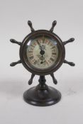 A brass cased desk clock in the form of a ship's wheel, 15cm high