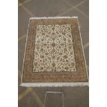 An antique cream ground deep pile wool tabriz carpet, 93" x 74"