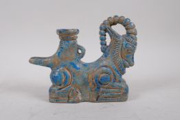 An Islamic turquoise glazed faience pourer in the form of a ram, 19cm long