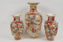 A garniture of three Meiji Satsuma vases, largest 31cm high