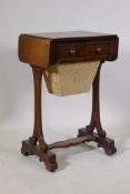 An early C19th mahogany worktable with single drawer and pull out basket, and drop end flaps, raised