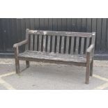 A slatted teak garden bench, 150cm wide