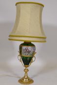 Porcelain table lamp with brass mounts, decorated with a hunting scene, 40cm high, 67cm with shade