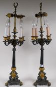 A pair of French style bronze four branch six lamp table lamps with gilt brass mounts, 76cm high