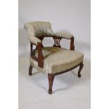 A C19th mahogany horseshoe back armchair on cabriole supports
