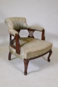 A C19th mahogany horseshoe back armchair on cabriole supports