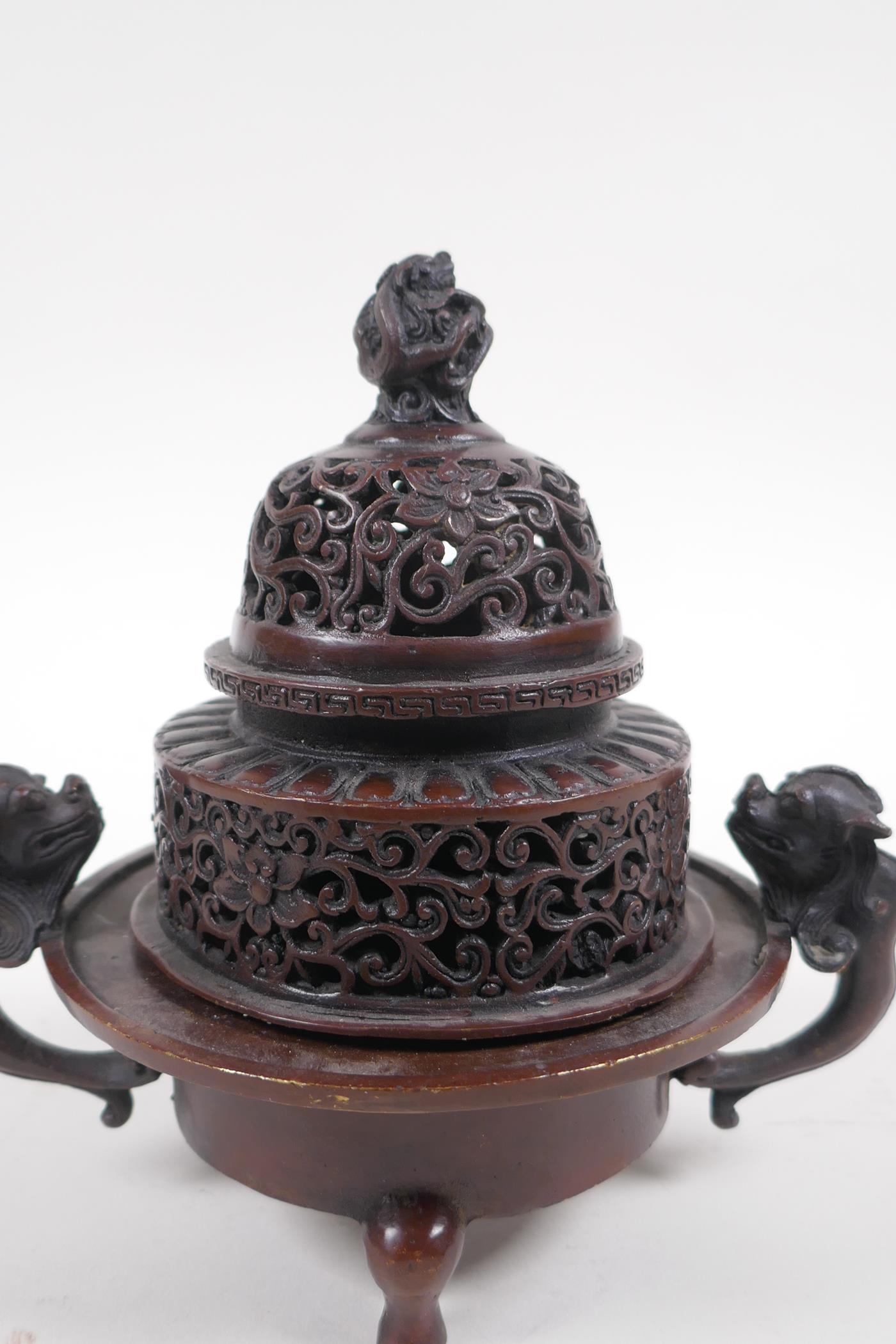 A Chinese bronze two handled censer and cover, with dragon knop and handles, raised on tripod - Image 2 of 5