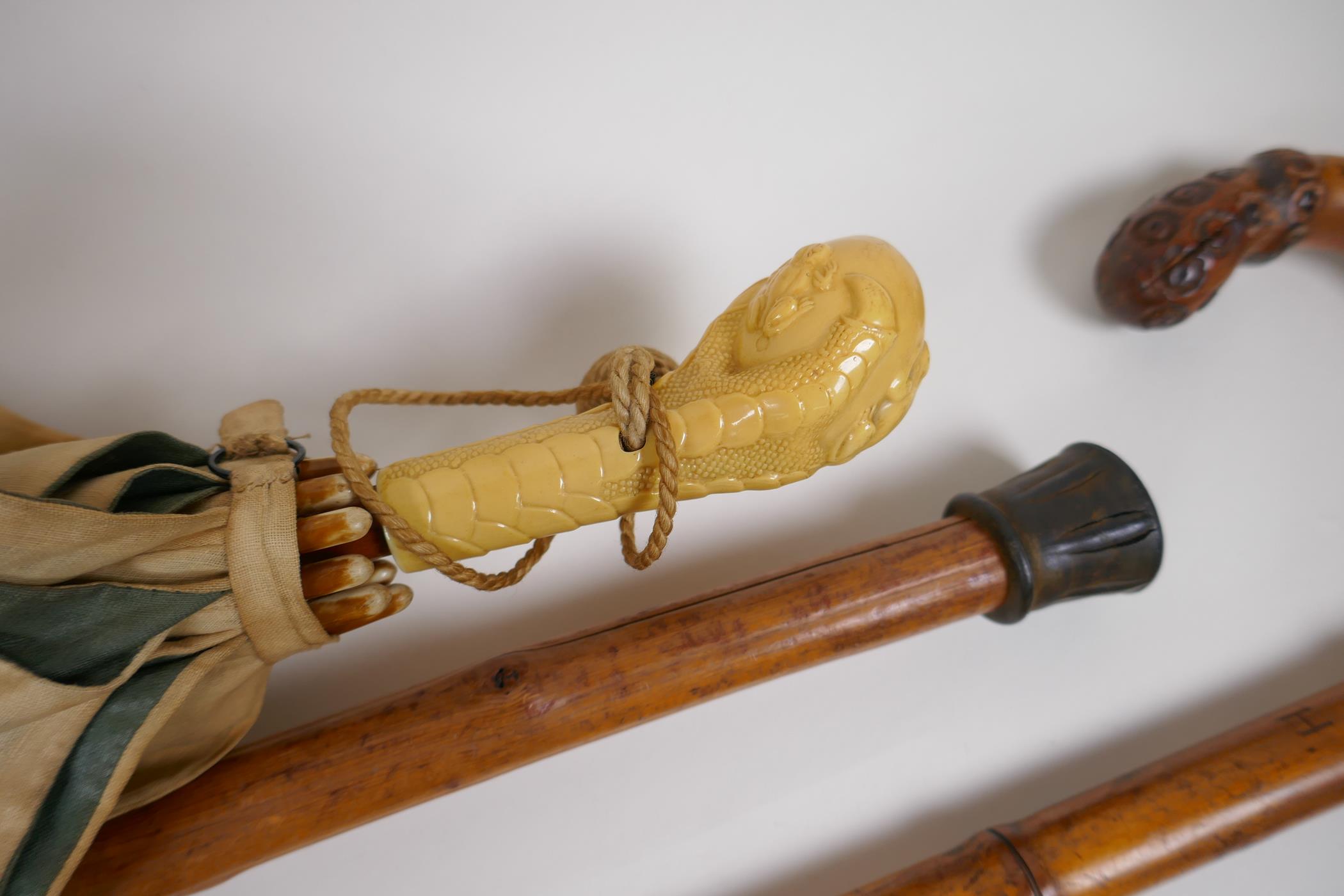 A collection of walking sticks including an ebonised stick with a hallmarked silver cuff, and a horn - Image 5 of 5