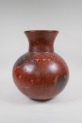 A stoneware vase with sgraffito floral decoration, 33cms high