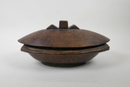 A New Guinea Trobriand Islands carved hardwood container, 34cm x 21cm