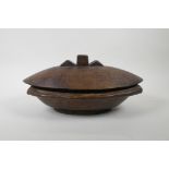 A New Guinea Trobriand Islands carved hardwood container, 34cm x 21cm