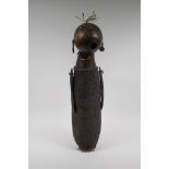 An African basket work and hollowed gourd doll with painted details, possibly Congolese, 59cm high