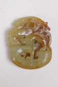 A Chinese celadon hardstone pendant carved in the form of a stylised dragon, 5cm