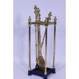 A Victorian brass fireside companion/stick stand, 63cm high