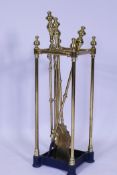 A Victorian brass fireside companion/stick stand, 63cm high