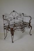 A mid century wrought iron garden bench with serpentine shaped front, 105 x 50 x 100cms