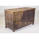 A late C18th/early C19th oak mule chest with triple panel top and front over a single drawer, raised