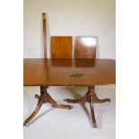 A Regency style mahogany twin pillar dining table with two extra leaves, 75 x 180 x 110cm without