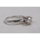 A platinum and diamond single stone engagement ring, approx 60 points, size I/J