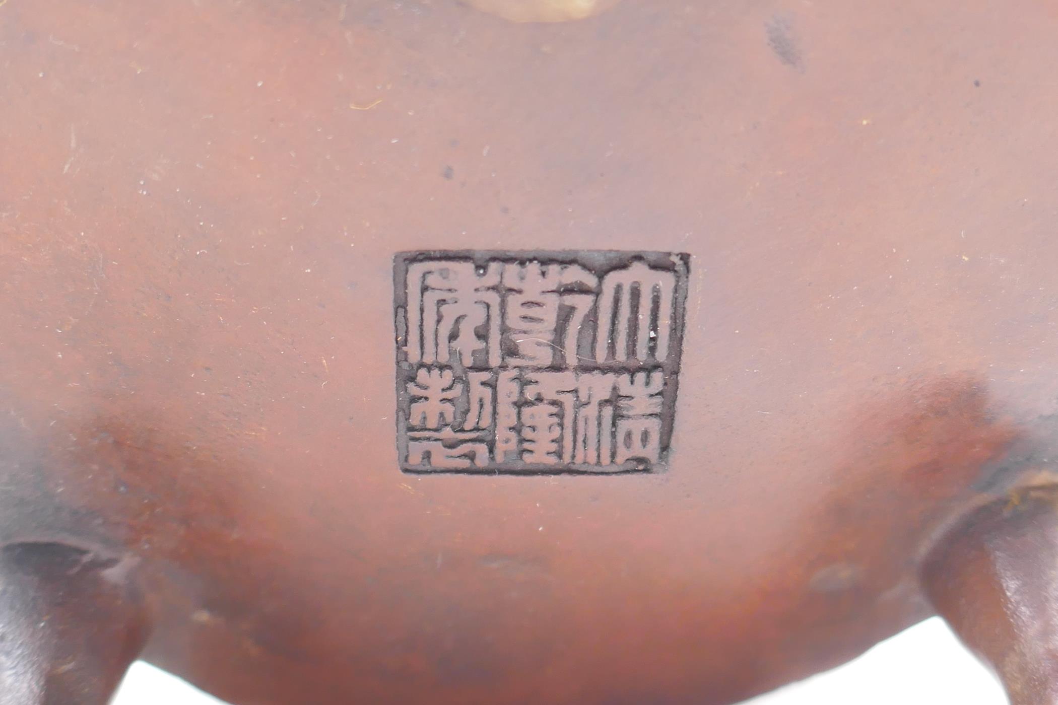 A Chinese bronze two handled censer and cover, with dragon knop and handles, raised on tripod - Image 5 of 5