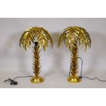 A pair of metal table lamps in the form of palm trees, with gilt metal leaf decoration, 72cm high