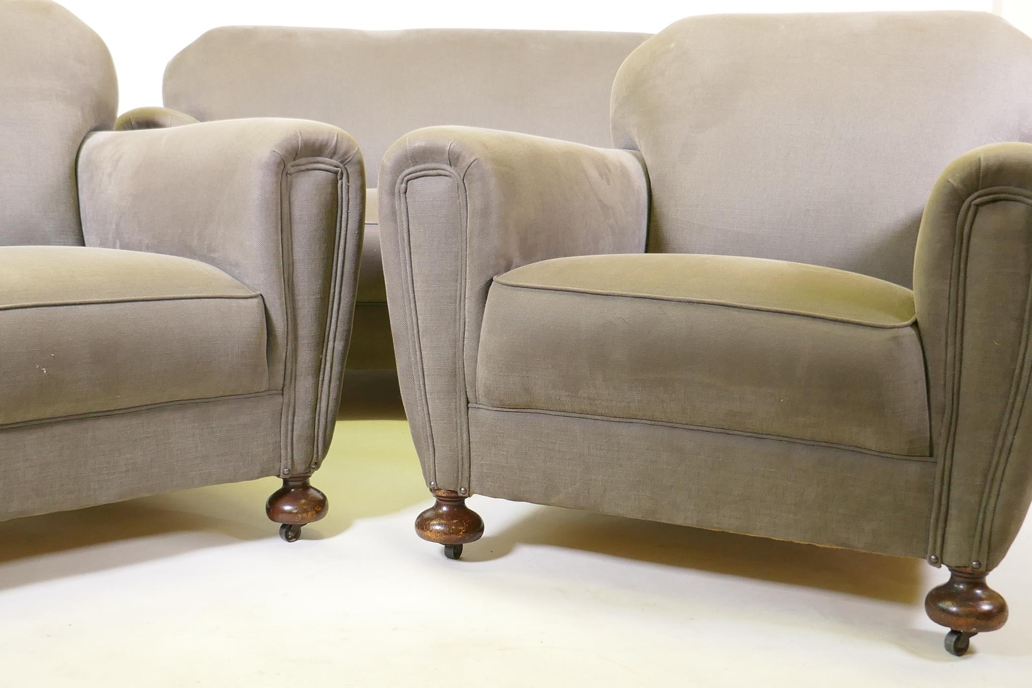 An Art Deco three piece suite, settee and two armchairs, well upholstered in a neutral fabric, 145cm - Image 3 of 6