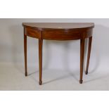 Georgian mahogany demi lune tea table, with crossbanded top and inlaid stringing, raised on square