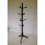 A Victorian ebonised wood coat stand, AF lacks one peg, 180cm high