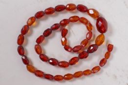 A faceted amber bead necklace, 52cm long, clasp AF
