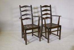 A pair of Ercol elbow chairs