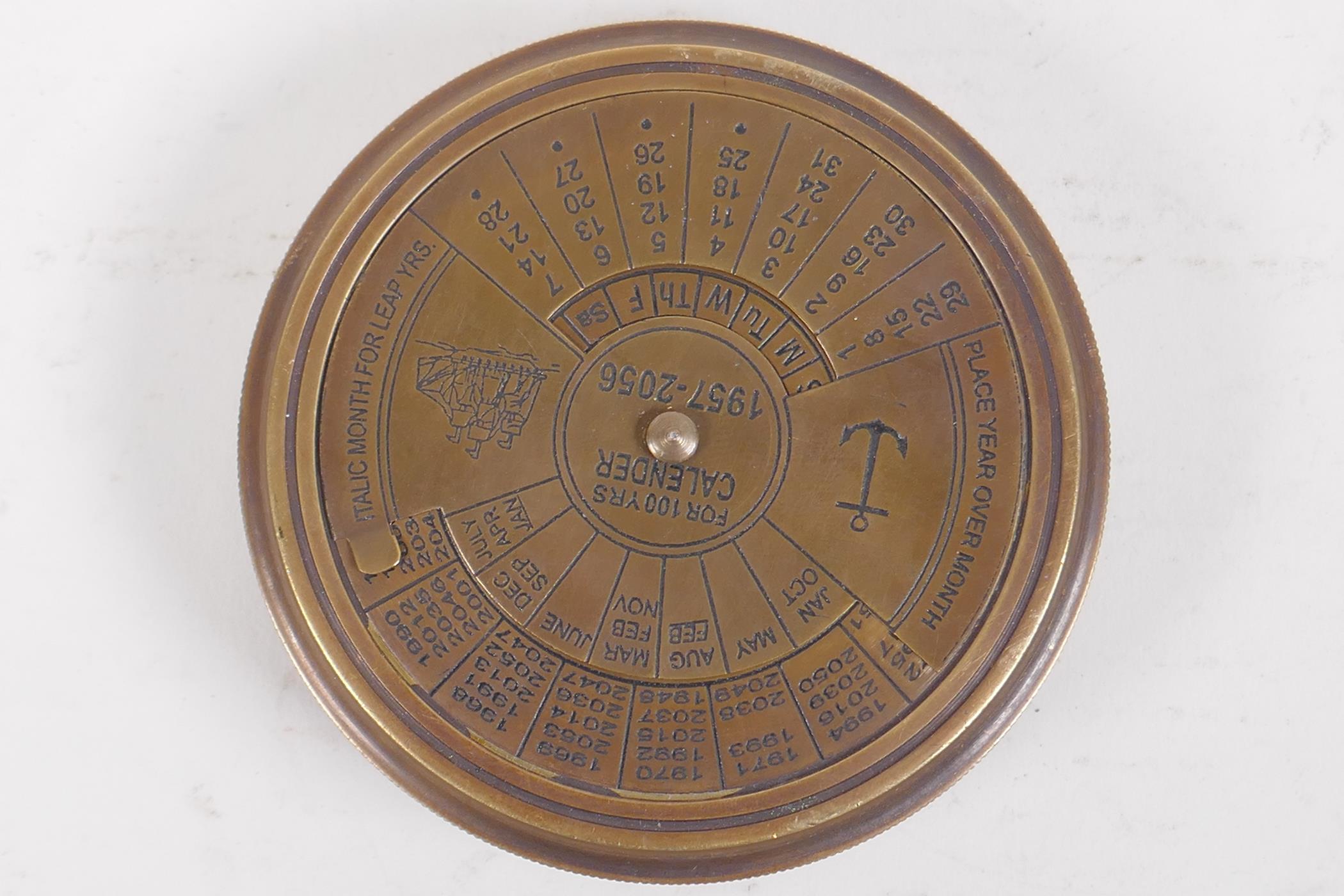 A brass cased pocket compass, 8cm diameter - Image 2 of 3