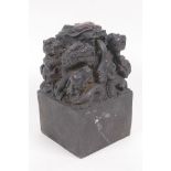 A heavy bronze seal cast with a dragon and young, with Chinese character marks to seal, 8.5cm