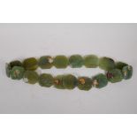 A Chinese green hardstone belt with carved phoenix decoration, 100cm long