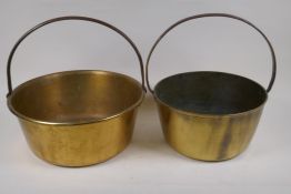 Two C19th brass maslin pans with iron handles, largest 35cm diameter