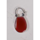 A sterling silver horseshoe padlock set with an agate stone, 3cm long